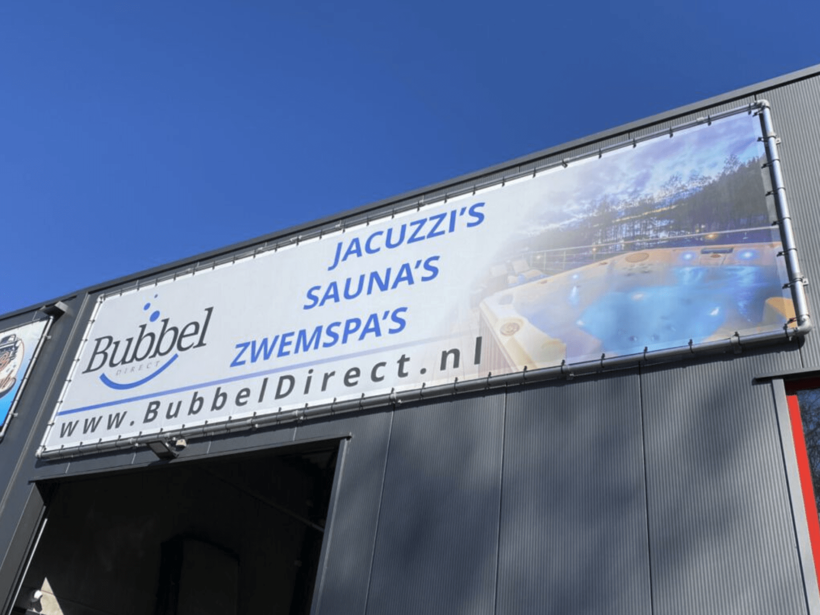 XXL spandoek belettering gevelreclame in Heerlen Maastricht Limburg Roermond Weert en Parkstad
